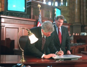 clinton-signs-telecomm-600x462